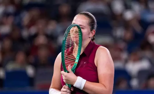 Jelena Ostapenko of Latvia reacts after a round against Sonay Kartal of Britain in a women's singles semifinal match during the 2026 Wuhan Open tennis tournament in Wuhan in central China's Hubei Province on Saturday, Oct. 17, 2026. (Chinatopix Via AP)