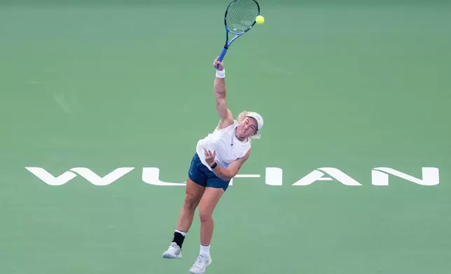 Sonay Kartal of Britain serves the ball against Jelena Ostapenko of Latvia in a women's singles semifinal match during the 2026 Wuhan Open tennis tournament in Wuhan in central China's Hubei Province on Saturday, Oct. 17, 2026. (Chinatopix Via AP)