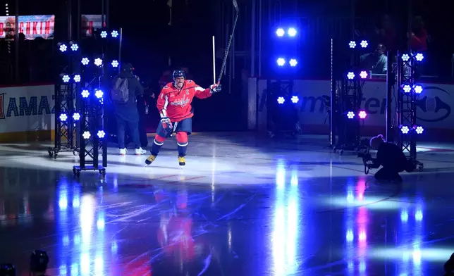 Washington Capitals left wing Alex Ovechkin (8) takes to the ice during player introductions before an NHL hockey game against the Pittsburgh Penguins, Wednesday, Oct. 7, 2026, in Washington. (AP Photo/Nick Wass)