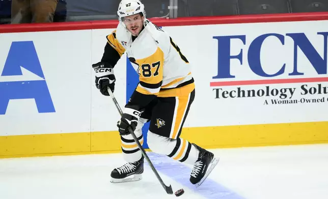 Pittsburgh Penguins center Sidney Crosby (87) warms up before an NHL hockey game against the Washington Capitals, Wednesday, Oct. 7, 2026, in Washington. (AP Photo/Nick Wass)