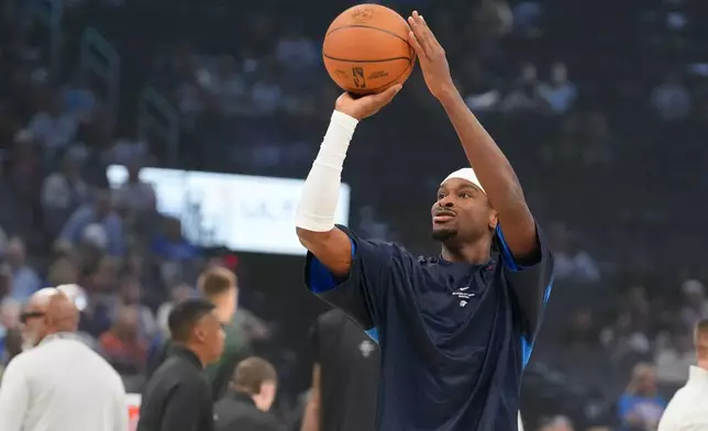 Oklahoma City Thunder guard Shai Gilgeous-Alexander warms up before an NBA basketball game, Wednesday, Oct. 7, 2026, against the Milwaukee Bucks in Oklahoma City. (AP Photo/Kyle Phillips)