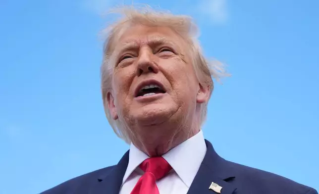 President Donald Trump speaks to reporters after arriving on Air Force One, Friday, Oct. 23, 2026, at Southwest Florida International Airport in Fort Myers, Fla. (AP Photo/Mark Schiefelbein)