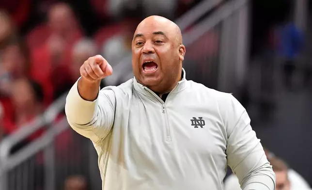 FILE - Notre Dame head coach Micah Shrewsberry shouts instructions to his team during the first half of an NCAA college basketball game against Louisville in Louisville, Ky., Feb. 4, 2026. (AP Photo/Timothy D. Easley, File)