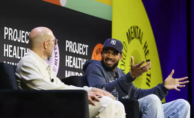 NBA player Karl-Anthony Towns of the New York Knicks sits for a discussion with Rich Kleiman at the Project Healthy Minds World Mental Health Day Festival, Saturday, Oct. 10, 2026, in New York. (AP Photo/Heather Khalifa)