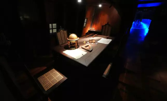 A table is displayed inside the full-scale reproduction of the 17th century Spanish galleon called Espiritu Santo at the Museo del Galeon in Manila, Philippines on Friday, Aug. 28, 2026. (AP Photo/Aaron Favila)