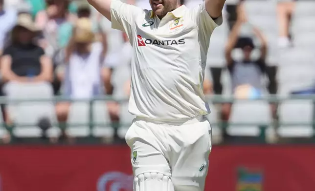 Australia's Josh Inglis celebrates his hundred, on day three of the third cricket test match between South Africa and Australia, in Cape Town, South Africa, Thursday, Oct. 29, 2026. (AP Photo/Halden Krog)
