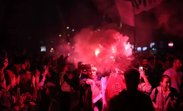 People welcome a group of students who have arrived ahead of a pre-election rally of "Student list - Students win" in Belgrade, Serbia, Wednesday, Oct. 21, 2026. (AP Photo/Armin Durgut)