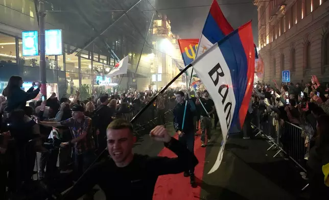 Supporters arrive ahead of a pre-election rally for the Students' List group in Belgrade, Serbia, Wednesday, Oct. 21, 2026. (AP Photo/Darko Vojinovic)