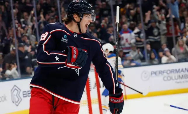 Columbus Blue Jackets' Matthew Knies celebrates after his goal against the Buffalo Sabres during the second period of an NHL hockey game, Thursday, Oct. 1, 2026, in Columbus, Ohio. (AP Photo/Jay LaPrete)