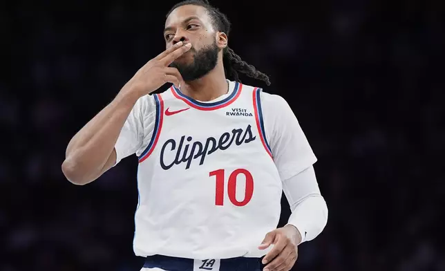 Los Angeles Clippers guard Darius Garland (10) celebrates after making a 3-point basket during the first half of an NBA Cup basketball game against the Minnesota Timberwolves, Friday, Oct. 30, 2026, in Minneapolis. (AP Photo/Abbie Parr)