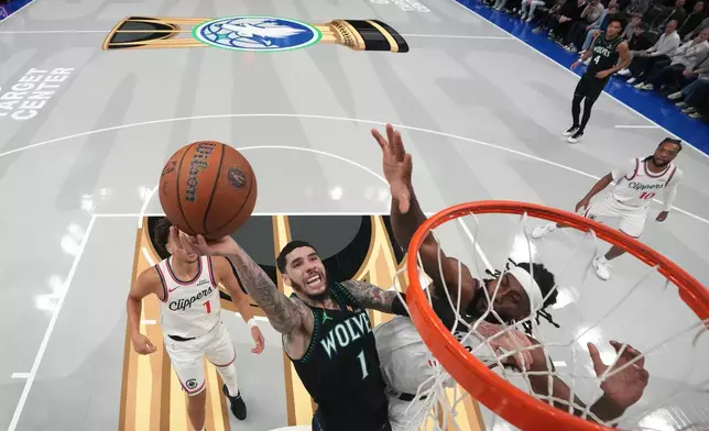 Minnesota Timberwolves guard LaMelo Ball (1) shoots over Los Angeles Clippers forward Isaiah Jackson, right, during the first half of an NBA Cup basketball game, Friday, Oct. 30, 2026, in Minneapolis. (AP Photo/Abbie Parr)