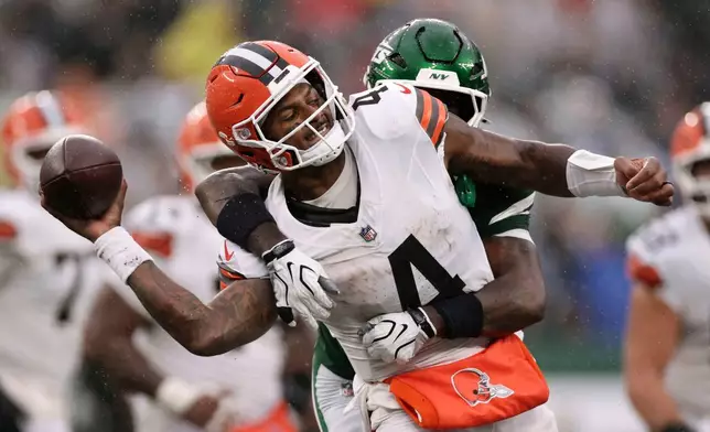 Cleveland Browns quarterback Deshaun Watson (4) is sacked by New York Jets cornerback Jarvis Brownlee Jr. during the second half of an NFL football game, Sunday, Oct. 11, 2026, in East Rutherford, N.J. (AP Photo/Adam Hunger)