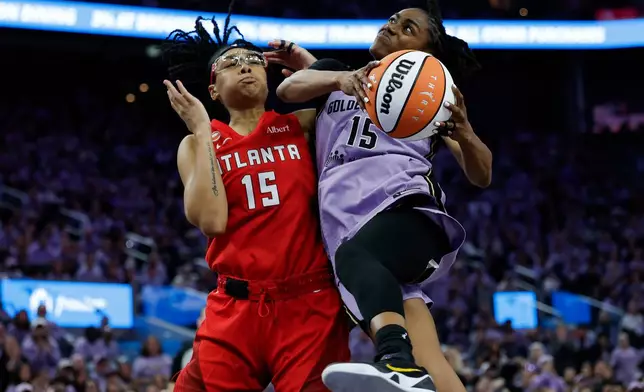 Golden State Valkyries guard Tiffany Hayes, right, looks to shoot while defended by Atlanta Dream guard Allisha Gray, left, during the second half of Game 2 of the WNBA basketball finals in San Francisco, Monday, Oct. 19, 2026. (Carlos Avila Gonzalez/San Francisco Chronicle via AP)