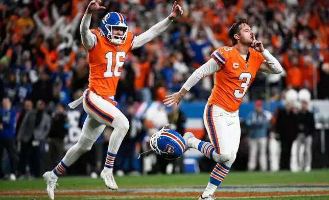 Denver Broncos place-kicker Wil Lutz (3) reacts with punter Jeremy Crawshaw (16) after making a field goal to win the game in overtime against the Seattle Seahawks in an NFL football game in Denver, Thursday, Oct. 15, 2026. (AP Photo/Geneva Heffernan)