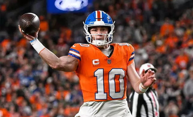 Denver Broncos quarterback Bo Nix throws against the Seattle Seahawks during the first half of an NFL football game in Denver, Thursday, Oct. 15, 2026. (AP Photo/Geneva Heffernan)