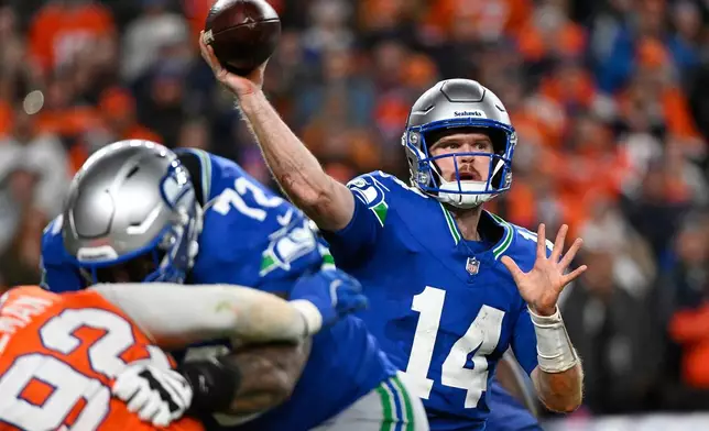 Seattle Seahawks quarterback Sam Darnold throws against the Denver Broncos during overtime in an NFL football game in Denver, Thursday, Oct. 15, 2026. (AP Photo/Geneva Heffernan)