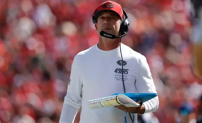 San Francisco 49ers head coach Kyle Shanahan walks on the sideline during the first half of an NFL football game against the Denver Broncos in Santa Clara, Calif., Sunday, Oct. 4, 2026. (AP Photo/Kelley L. Cox)