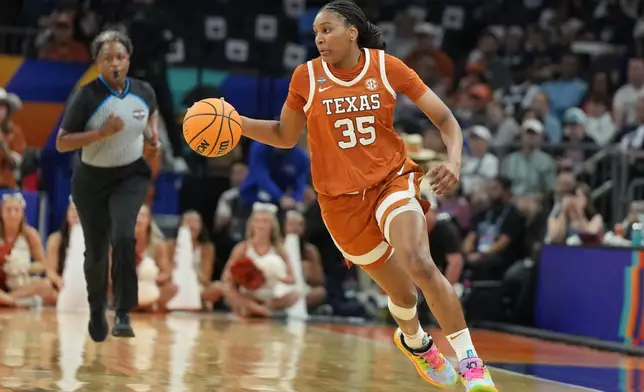 FILE - Texas forward Madison Booker during the first half of a women's NCAA college basketball tournament semifinal game against UCLA at the Final Four, April 3, 2026, in Phoenix. (AP Photo/Rick Scuteri, File)