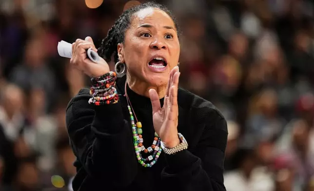 FILE - South Carolina head coach Dawn Staley reacts during the second half of an NCAA college basketball game against Texas in the final of the Southeastern Conference tournament, March 8, 2026, in Greenville, S.C. (AP Photo/Chris Carlson, File)