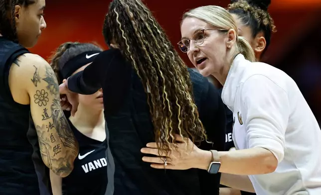 FILE - Vanderbilt head coach Shea Ralph, right, talks to guard Mikayla Blakes, center, and others during a timeout in the second half of an NCAA college basketball game against Tennessee in Knoxville, Tenn., March 1, 2026. (AP Photo/Wade Payne, File)