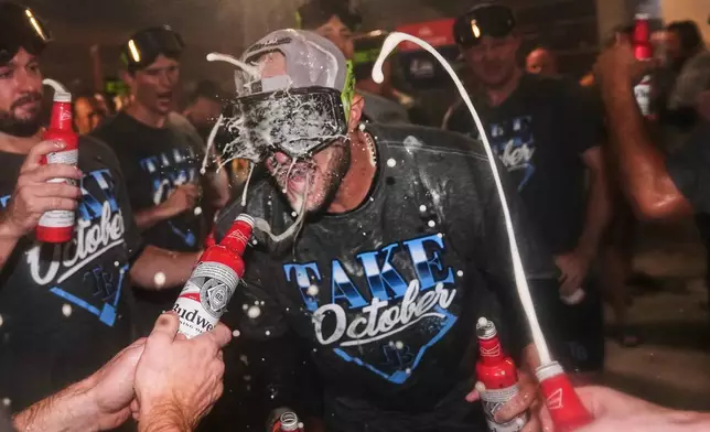 The Tampa Bay Rays celebrate the team's win in Game 3 of baseball's American League Division Series against the New York Yankees, Wednesday, Oct. 7, 2026, in New York. (AP Photo/Seth Wenig)