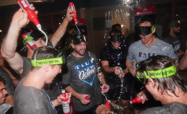 The Tampa Bay Rays celebrate the team's win in Game 3 of baseball's American League Division Series against the New York Yankees, Wednesday, Oct. 7, 2026, in New York. (AP Photo/Seth Wenig)