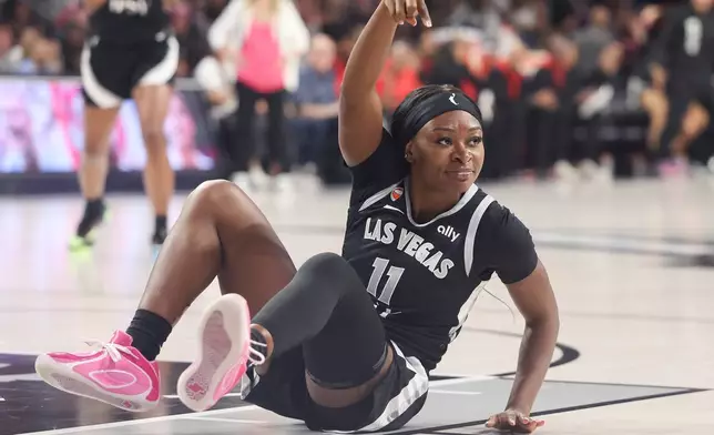 Las Vegas Aces guard Dana Evans reacts after making basket while being fouled during the first half of Game 3 of the WNBA basketball semifinals against the Golden State Valkyries, Friday, Oct. 9, 2026, in Las Vegas. (AP Photo/Ian Maule)