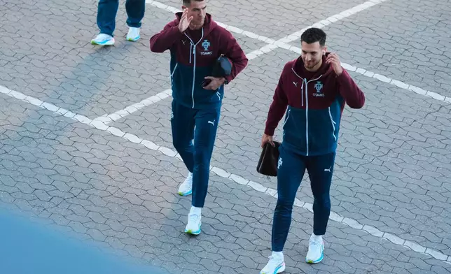 Portugal's Cristiano Ronaldo, left, and Diogo Dalot arrive for training in Copenhagen, Denmark, Wednesday, Sept. 30, 2026, ahead of their Nations League soccer match against Denmark. (Liselotte Sabroe/Ritzau Scanpix via AP)