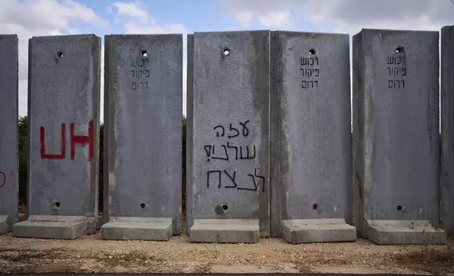Graffiti in Hebrew on a concrete wall reads: "Gaza is ours forever" near Kibbutz Netiv HaAsara, which is near the Israel-Gaza border in southern Israel, Wednesday, Sept. 30, 2026. (AP Photo/Oded Balilty)