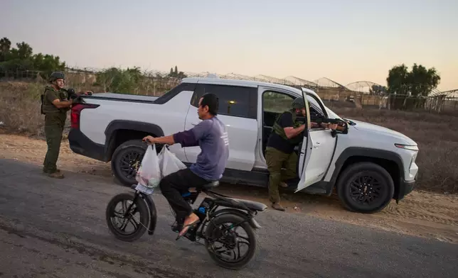 Members of the Yesha community attend military training during the simulation of a militant attack, under the direction of volunteers from a group called Magen48, in southern Israel along the border with Gaza, Sunday, Oct. 4, 2026. (AP Photo/Oded Balilty)