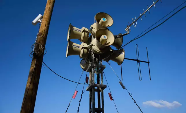 Alarm sirens stand at the site of the Nova music festival, where hundreds of revelers were killed and abducted in the Oct. 7 Hamas attack three years prior, near Kibbutz Reim in southern Israel, Sunday, Oct. 4, 2026. (AP Photo/Oded Balilty)