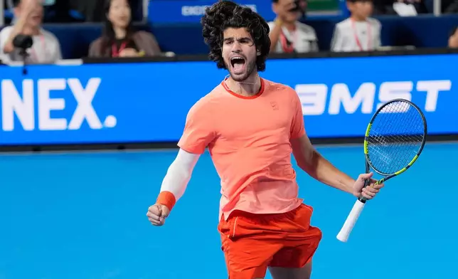 Spain's Carlos Alcaraz celebrates after winning the men's singles final against Czechia's Jiri Lehecka at the Japan Open tennis tournament in Tokyo, Tuesday, Oct. 6, 2026. (AP Photo/Eugene Hoshiko)