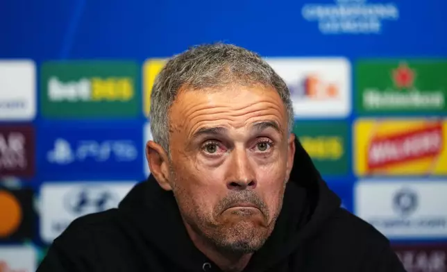 Paris Saint-Germain manager Luis Enrique reacts during a press conference, Tuesday, Oct. 13, 2026, in Manchester, England, a day ahead of their Champions League soccer match against Manchester City. (Martin Rickett/PA via AP)