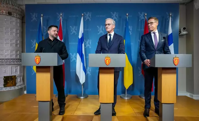Ukrainian President Volodymyr Zelenskyj, Prime Minister Jonas Gahr Støre, and Finnish President Alexander Stubb speak during a press conference on Tuesday, Oct. 20, 2026 in Oslo, Norway. (Lise Åserud/NTB Scanpix via AP)