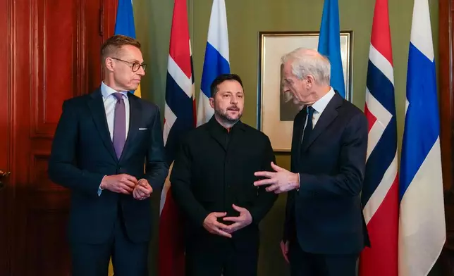 Ukrainian President Volodymyr Zelenskyy, center, meets Norwegian Prime Minister Jonas Gahr Støre and Finnish President Alexander Stubb, left, in Oslo, Norway, Tuesday, Oct. 20, 2026. (Heiko Junge, Pool Photo via AP)