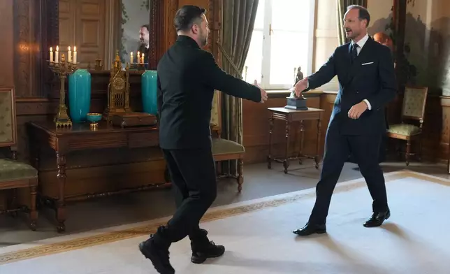 Norway King Haakon VIII, right, welcomes Ukrainian President Volodymyr Zelenskyy on the occasion of their audience at the Royal Palace, in Oslo, Tuesday, Oct. 20, 2026. (Ole Berg-Rusten/NTB Scanpix via AP)
