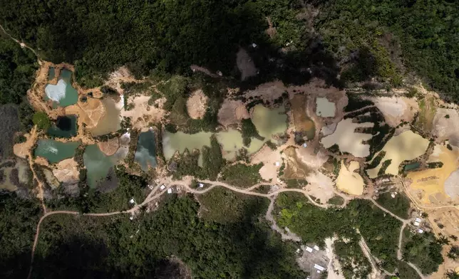 Illegal mining is visible in the Saamaka territory of the Amazon rainforest outside of Paramaribo, Suriname, Saturday, Sept. 26, 2026. (AP Photo/Ivan Valencia)