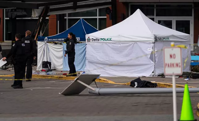 Emergency personnel respond after a vehicle drove through a Truth and Reconciliation event at the Tsawwassen Mills Mall in Tsawwassen, British Columbia, Canada, Wednesday, Sept. 30, 2026. (Rich Lam/The Canadian Press via AP)