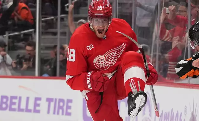 Detroit Red Wings center Andrew Copp (18) celebrates his goal against the Philadelphia Flyers in the third period of an NHL hockey game Thursday, Oct. 15, 2026, in Detroit. (AP Photo/Paul Sancya)