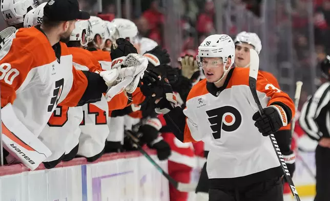 Philadelphia Flyers right wing Matvei Michkov (39) celerbrates his goal against the Detroit Red Wings in the first period of an NHL hockey game Thursday, Oct. 15, 2026, in Detroit. (AP Photo/Paul Sancya)