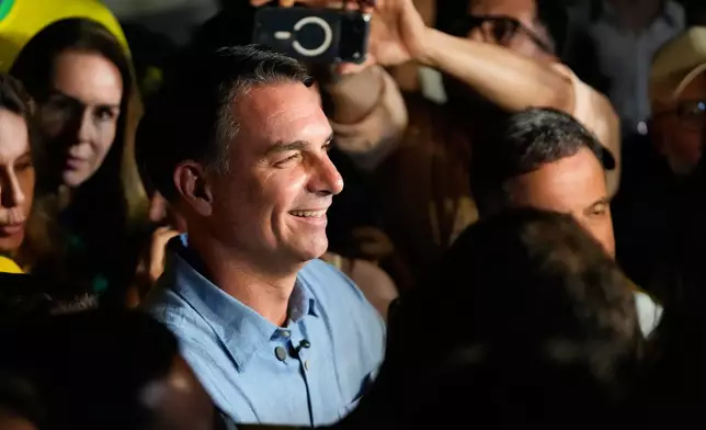 Opposition presidential candidate Sen. Flavio Bolsonaro speaks after advancing to a runoff election following the first round of the presidential election in Brasilia, Brazil, Sunday, Oct. 4, 2026. (AP Photo/Eraldo Peres)