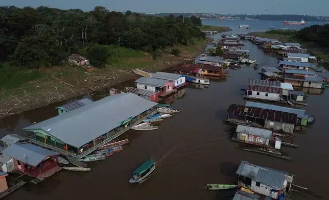 Boats are moored to a school serving as a polling station during general elections in Iranduba, Brazil, Sunday, Oct. 4, 2026. (AP Photo/Edmar Barros)