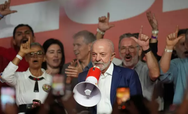 President Luiz Inacio Lula da Silva, who is running for reelection, speaks to supporters after advancing to a presidential runoff following the first round in Sao Paulo, Brazil, Sunday, Oct. 4, 2026. (AP Photo/Andre Penner)