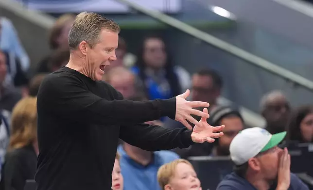 Dallas Mavericks head coach Dusty May reacts during the first half of an NBA basketball game against the San Antonio Spurs , Saturday, Oct. 24, 2026, in Dallas. (AP Photo/Julio Cortez)