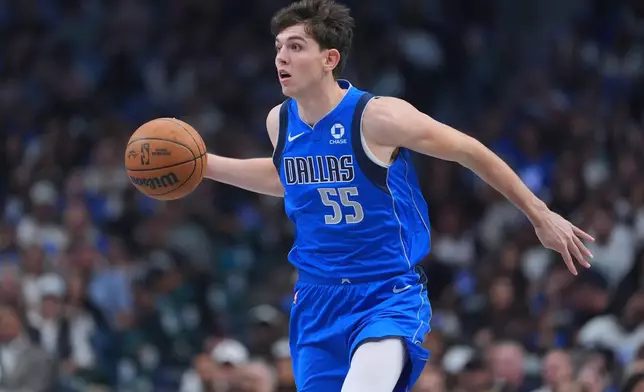 Dallas Mavericks forward Sergio de Larrea works the floor against the San Antonio Spurs during the first half of an NBA basketball game Saturday, Oct. 24, 2026, in Dallas. (AP Photo/Julio Cortez)
