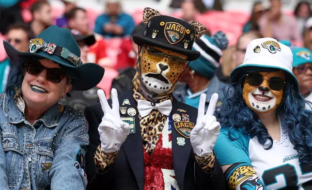 Jacksonville Jaguars take their seats ahead of an NFL football game against Houston Texans in London, Sunday, Oct. 18, 2026. (AP Photo/Ian Walton)