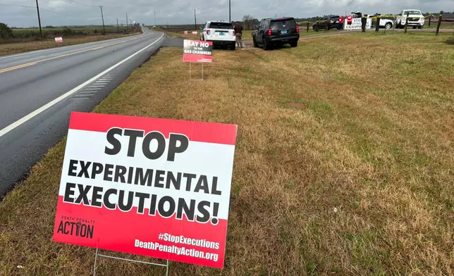 FILE - Anti-death penalty signs placed by activists stand along the road heading to Holman Correctional Facility in Atmore, Ala., ahead of the scheduled execution of Kenneth Eugene Smith on Jan. 25, 2024. (AP Photo/Kim Chandler, File)