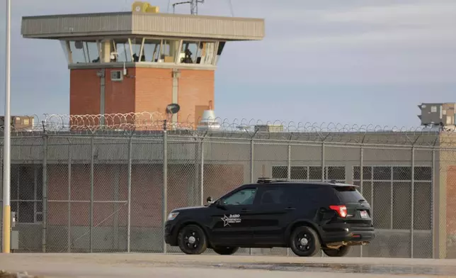 FILE - An Idaho department of corrections vehicle patrols the Idaho State prison complex near Kuna, Idaho, on Feb. 28, 2024. (AP Photo/Kyle Green, File)