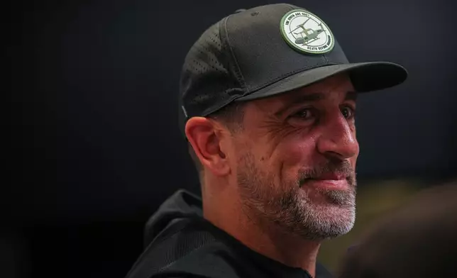 Pittsburgh Steelers quarterback Aaron Rodgers leaves a press conference in Paris, Friday, Oct. 23, 2026. (AP Photo/Aurelien Morissard)