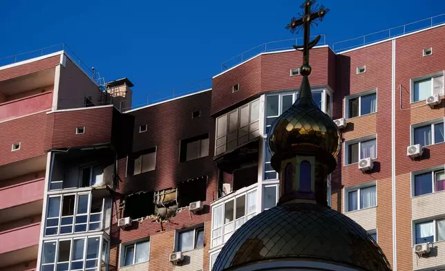 A residential building is seen damaged following a Russian drone strike, in Kyiv, Ukraine, Friday, Oct. 2, 2026. (AP Photo/Evgeniy Maloletka)